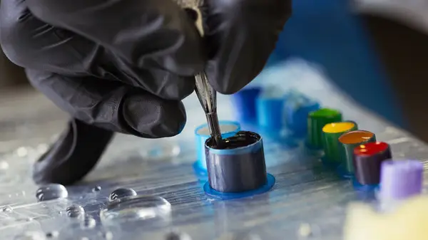 Tattoo needle in black ink