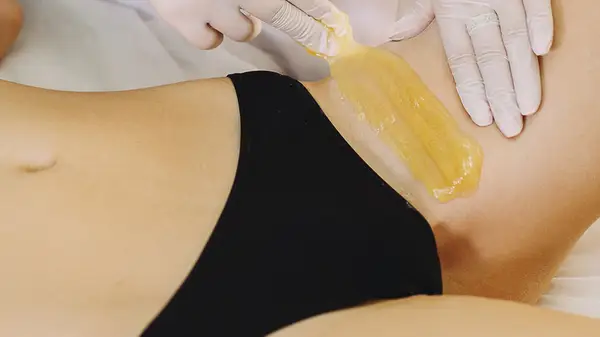 Person getting waxed
