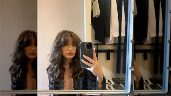 Woman with curtain bangs