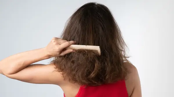 Woman combing her hair