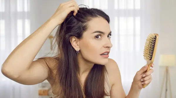 Woman touching her hair
