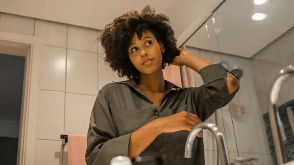 Woman touching her hair