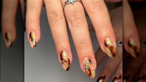 Tortoiseshell manicure with gold leaf