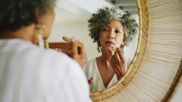 Woman applying foundation