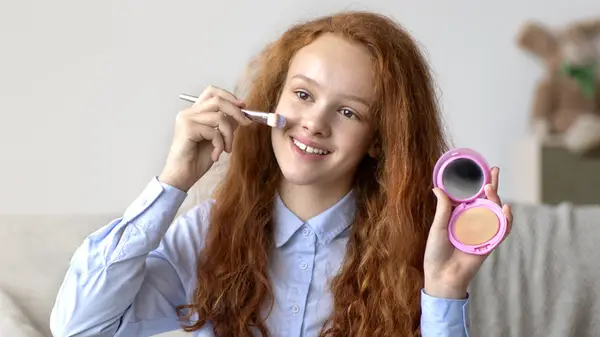 Woman applying makeup