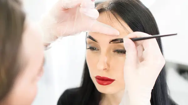 Woman having her brows tinted