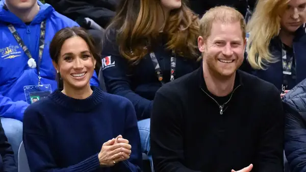 Meghan Markle smiling with Prince Harry