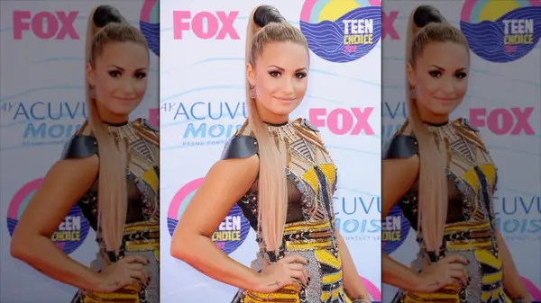 Demi Lovato with a long, blond ponytail