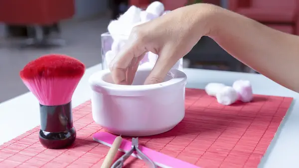 Soaking hand in bowl