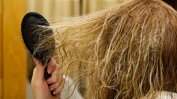Combing tangled hair