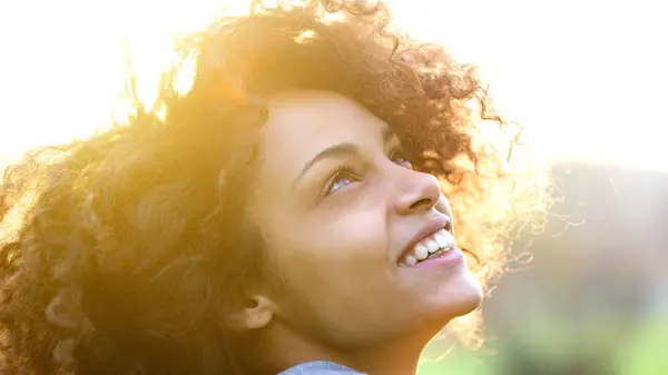 Woman smiling in the sun