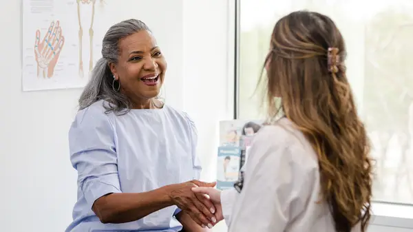 Woman speaking to a doctor