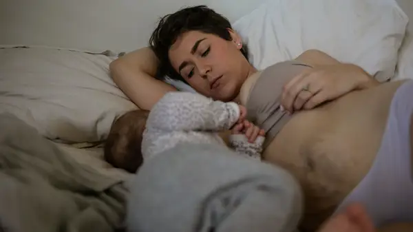 mom with stretch marks and baby