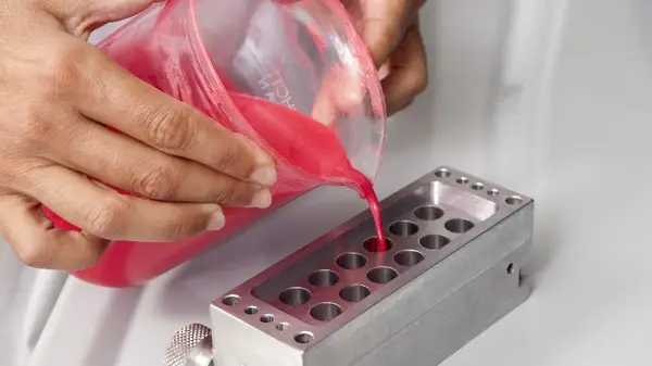 Pouring lipstick into molds