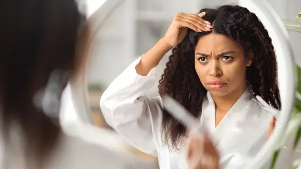 Woman touching her hair