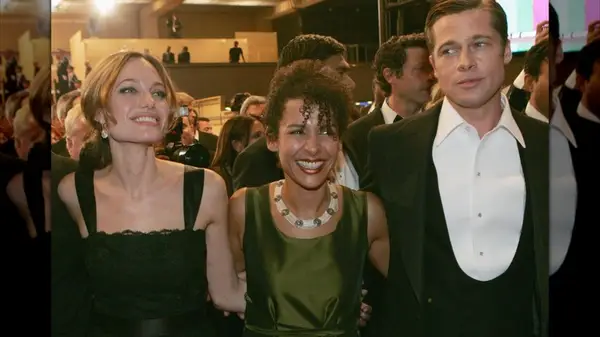 Mariane Pearl standing between Angelina Jolie and Brad Pitt at a red carpet event