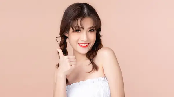 woman two loose braids in hair