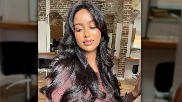 Woman with long curled hair
