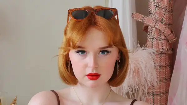 Woman with baby curtain bangs