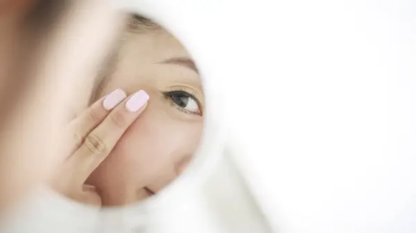 Woman doing skin care routine