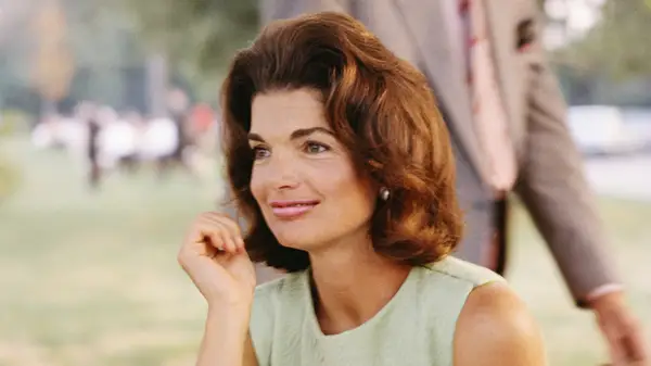 Jackie Kennedy sitting outside