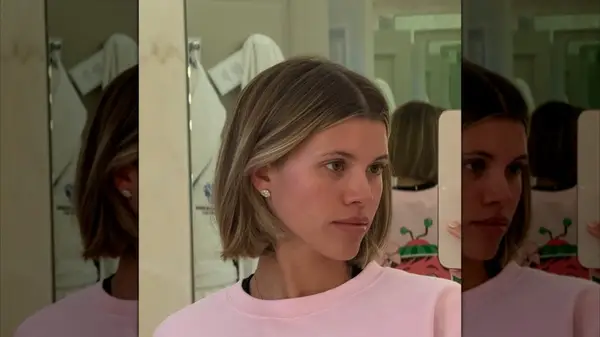 Sofia Richie taking a mirror selfie with her hair cut into a French bob