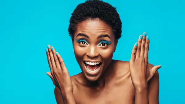 Woman wearing bright blue eyeshadow