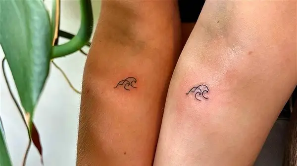 Matching wave tattoos