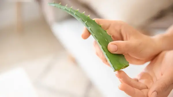 applying aloe to hands