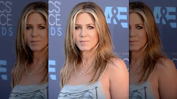 Jennifer Aniston attending an event with blonde money pieces framing her face