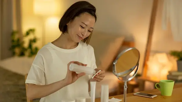 Woman doing her skin care routine