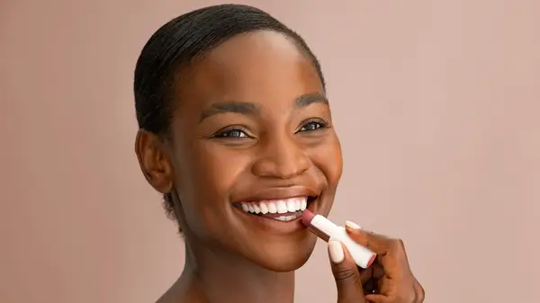 woman applying lipstick