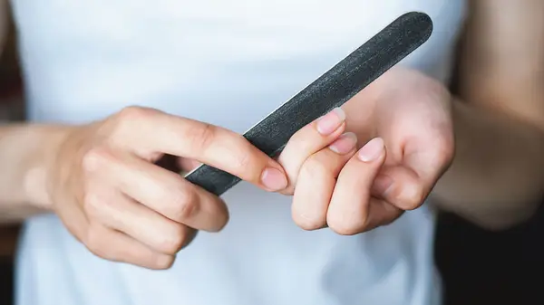 Holding a file near nails