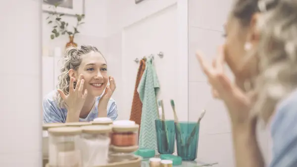 Woman applying skincare