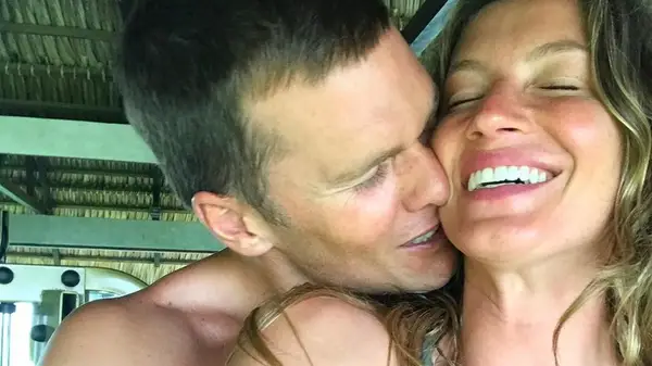 Tom Brady hugging Gisele Bundchen