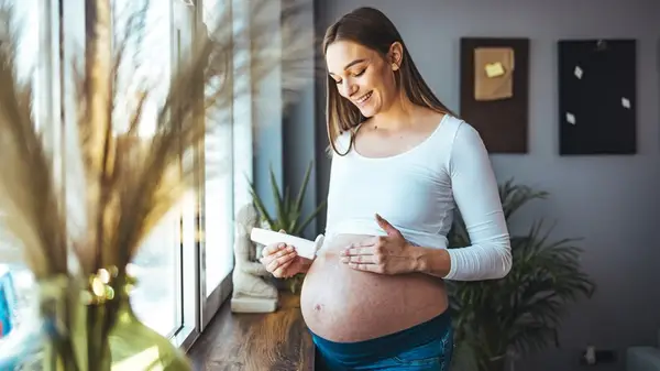 Lotioning pregnant belly