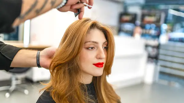 Woman with red hair at a salon
