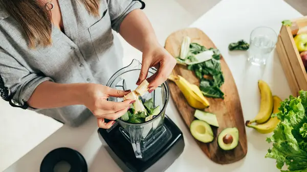 Woman making smoothie