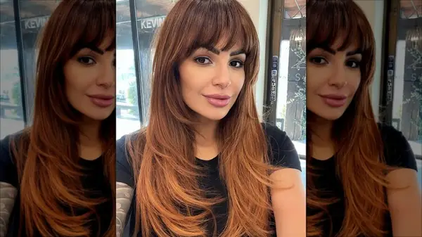 Woman with bangs and layers