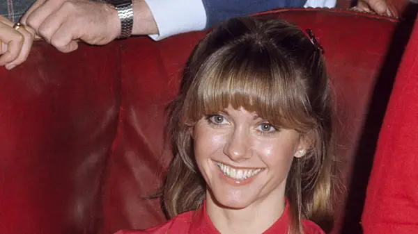 Olivia Newton John with half-up, half-down hair