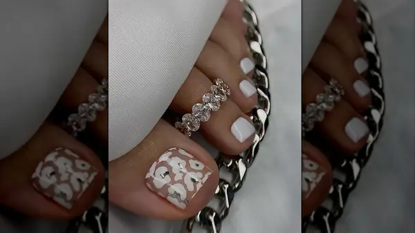 isolated chrome pedicure of white and silver
