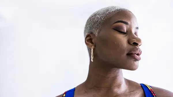 Woman with short white buzz cut