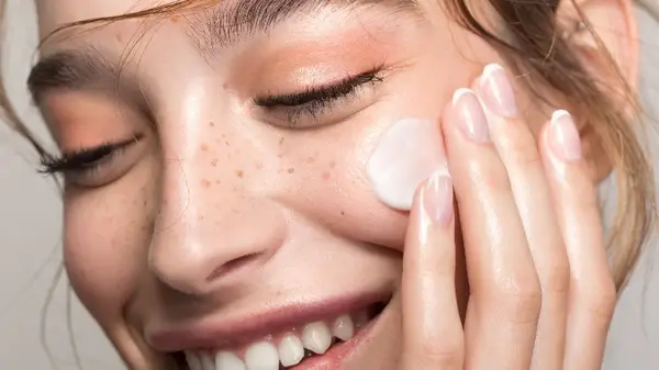 Woman applying cream