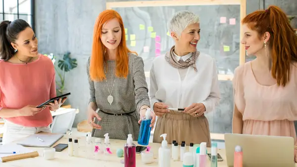 Women trying out beauty products