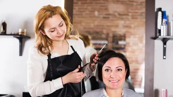 woman curling her hair