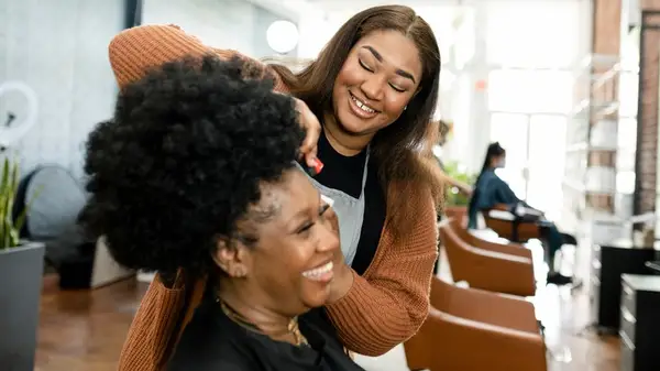 Hairdresser doing hair