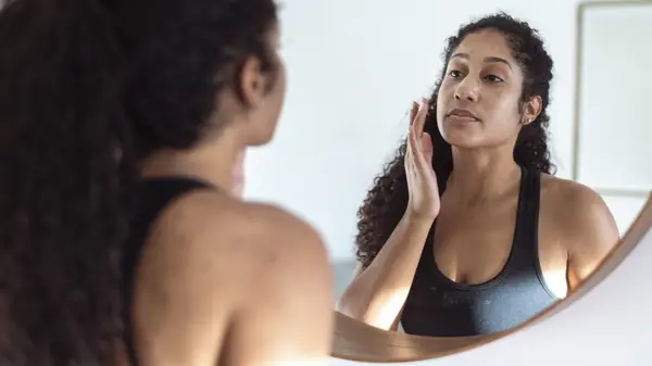 Woman touching her skin