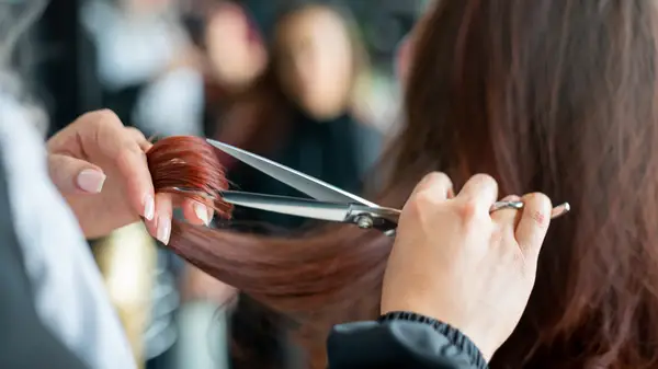 woman getting haircut