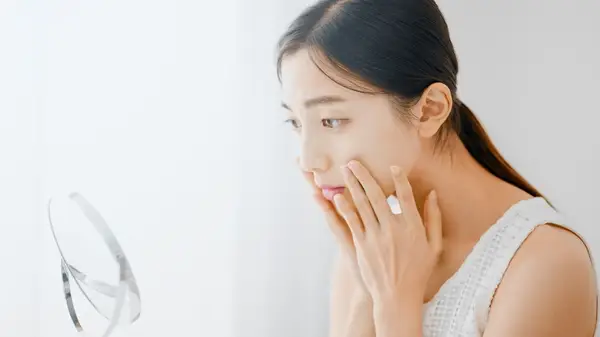 A woman checking her face