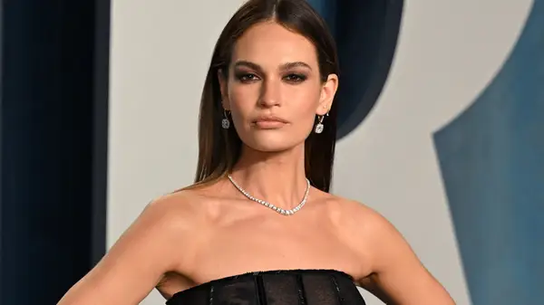 Lily James with straight dark brown hair